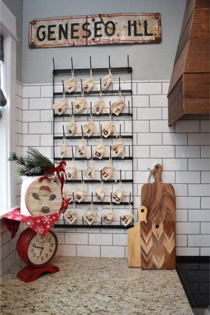 This advent calendar is made with small canvas bags on a mug rack.